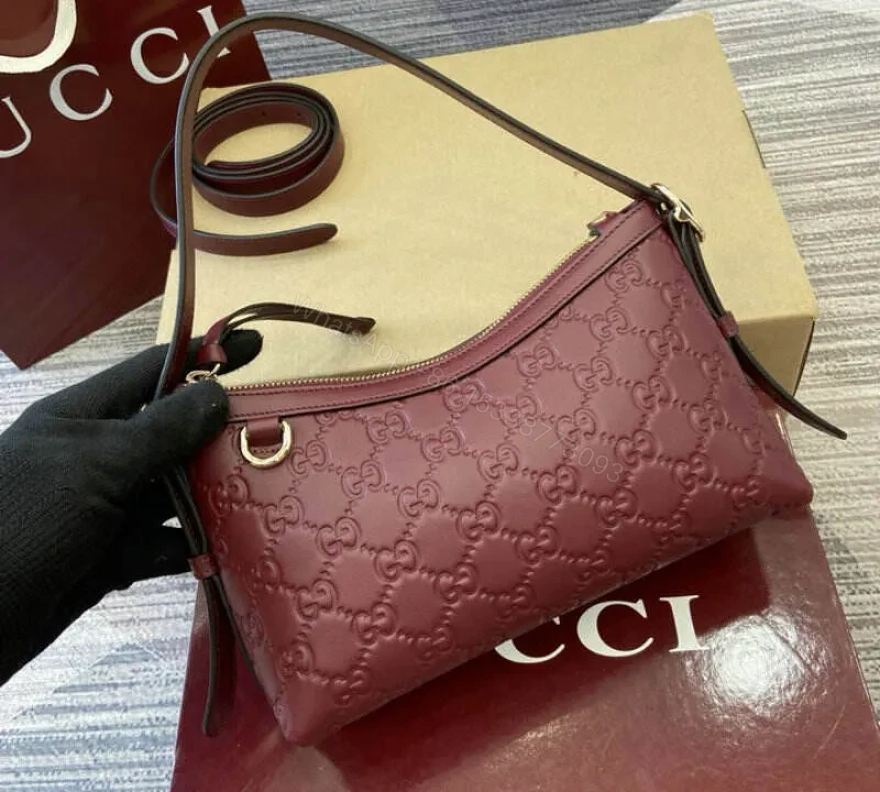 View 2 of Gucci GG Emblem Small Shoulder Bag – Rosso Ancora Red Leather