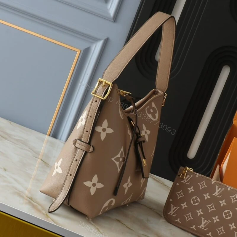View 4 of Louis Vuitton Carryall PM Bicolor Monogram Empreinte Dove And Cream 29Cm M47180