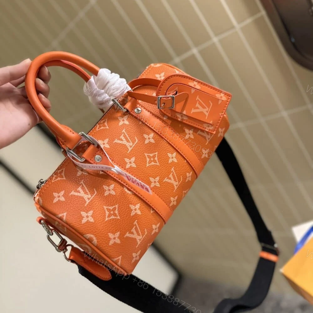 View 3 of Louis Vuitton Keepall Bandoulière 25 Tangerine 25Cm M31044