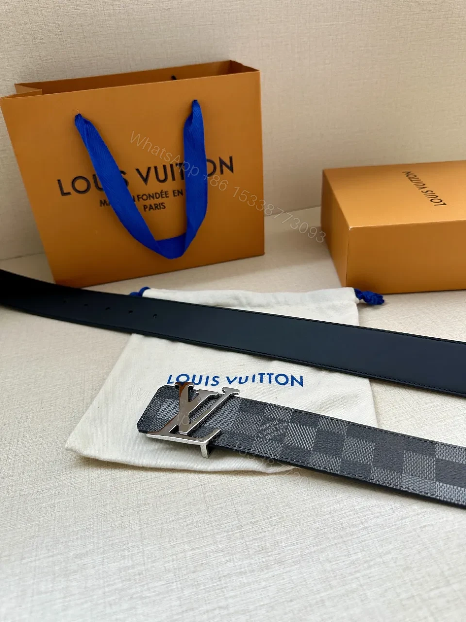 View 5 of Checkerboard Canvas Belt with Signature Buckle – Premium Modern Accessory