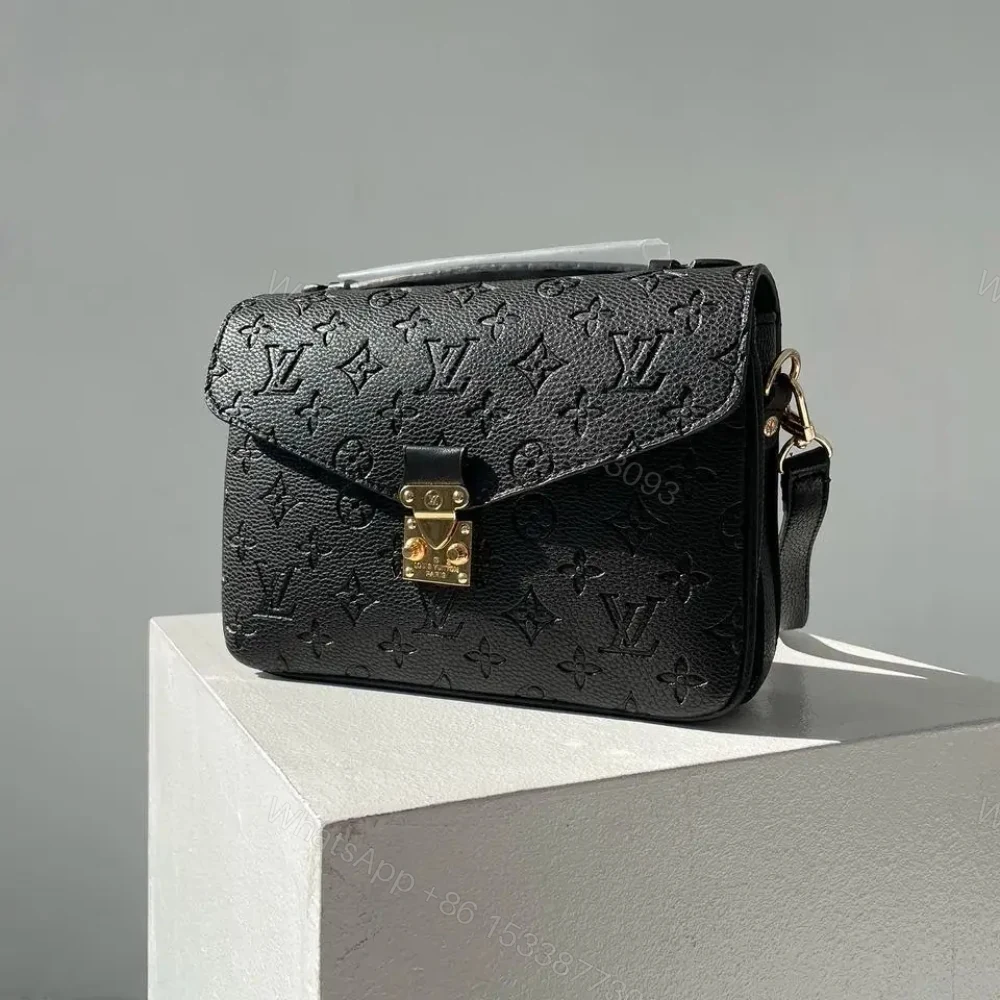 View 3 of Louis Vuitton Pochette Métis Monogram Empreinte Black 25Cm M41487