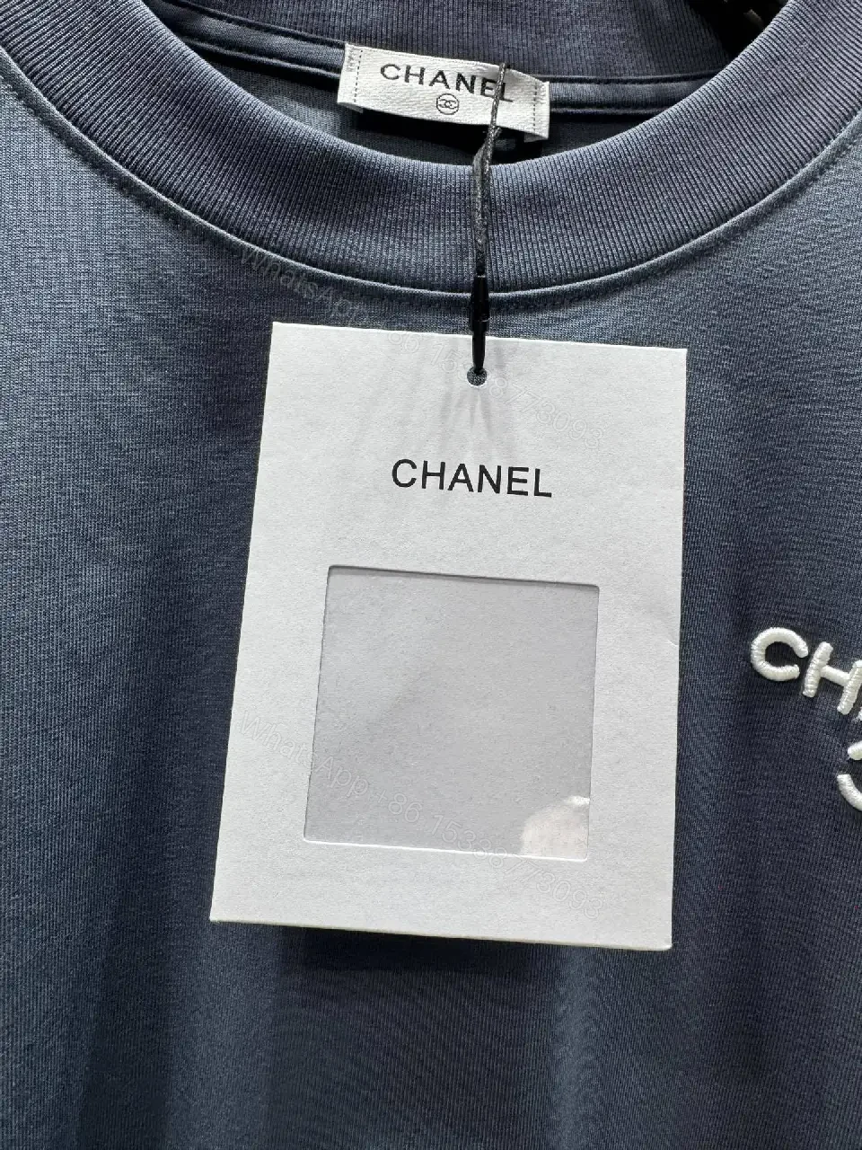 View 5 of Navy Knit Tee: Subtle Crest, Luxe Texture, Relaxed Fit Top