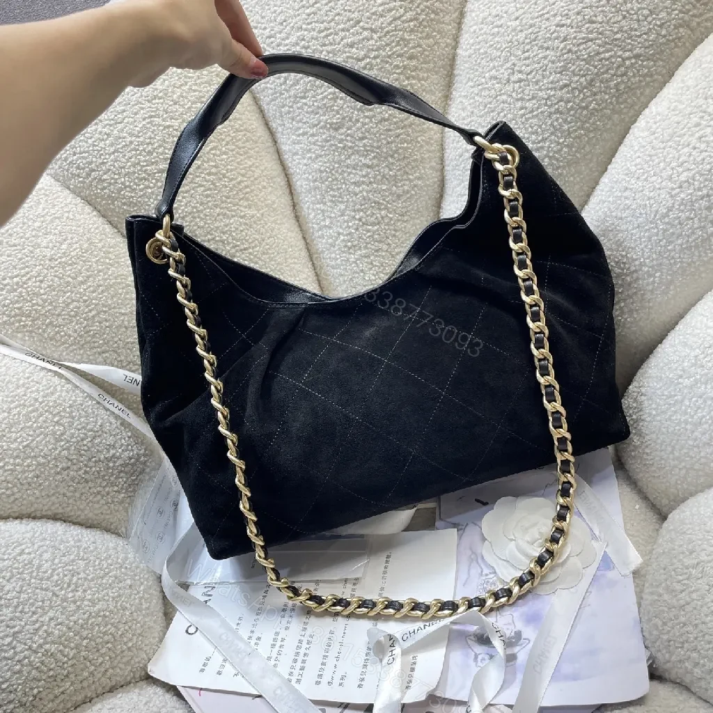 View 4 of Quilted Black Bag with Gold Chain, Top Handle, Compact