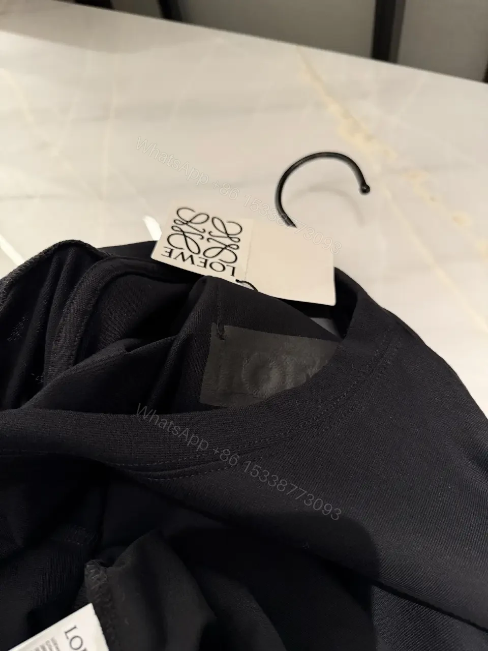View 7 of Black Cotton Crew Tee with Pocket – Subtle Luxe Comfort