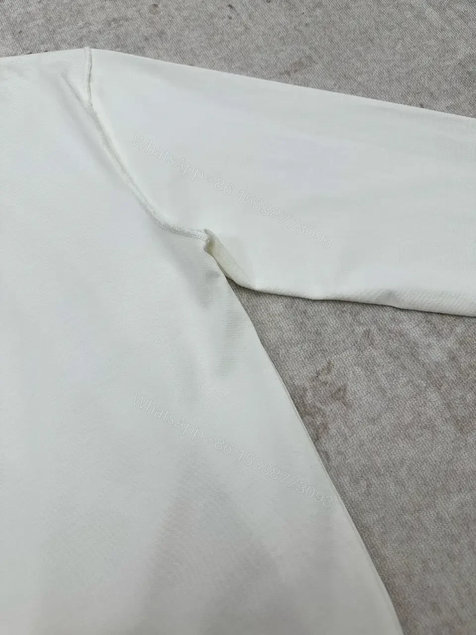 View 3 of Minimalist Luxe White Crewneck with Subtle Embossed DetailTop