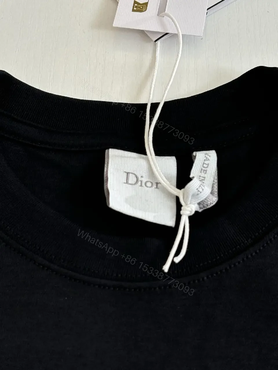 View 9 of Minimalist Black Cotton Tee with Bold No Dior No Dietrich Statement
