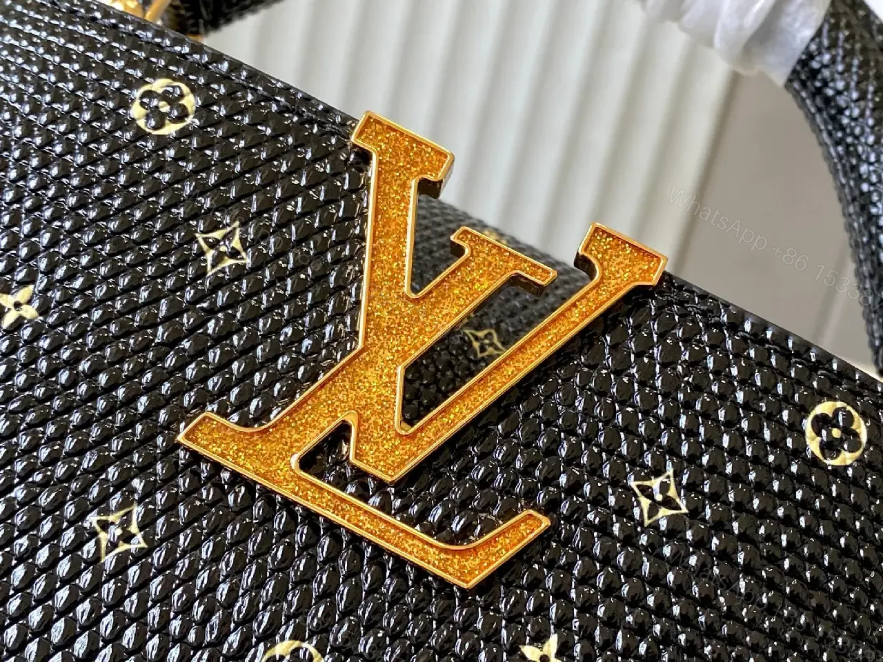 View 9 of Compact Black Pebble-Grain Top-Handle Bag with Gold Hardware