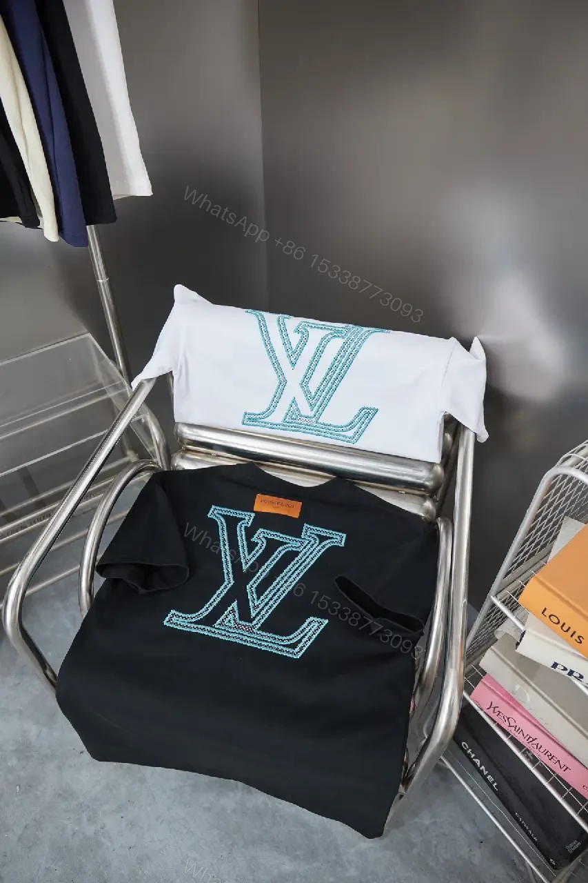 View 10 of Black Cotton Tee with Teal Embroidered Logo Accent, Minimalist Style, Everyday Luxury Tee