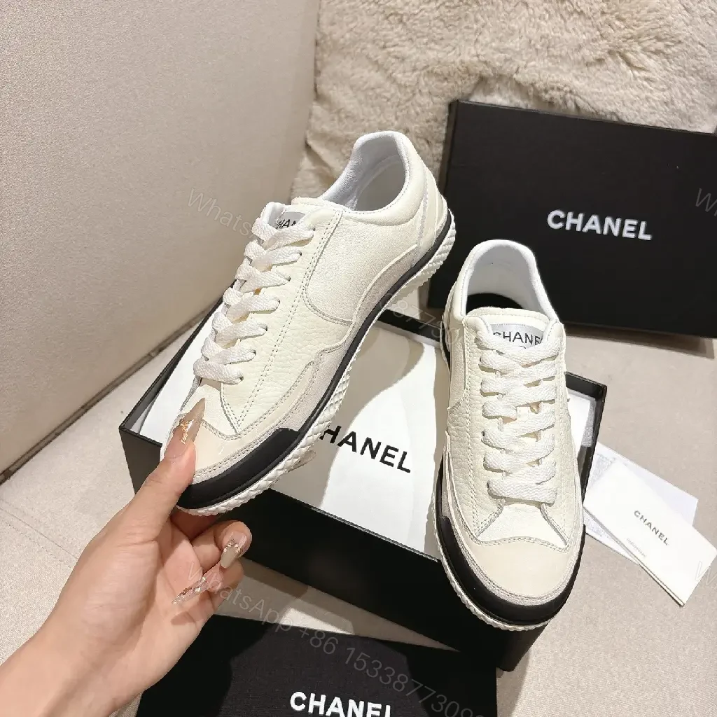 View 4 of Cream Leather-Texture Sneaker with Signature Emblem, Modern Couture Style