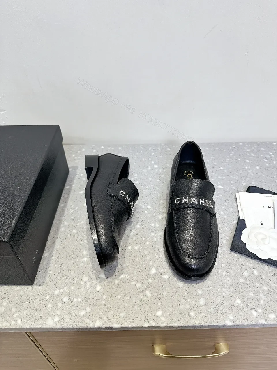 View 9 of Black Leather Slip-On with Logo Strap – Modern Luxe Comfort