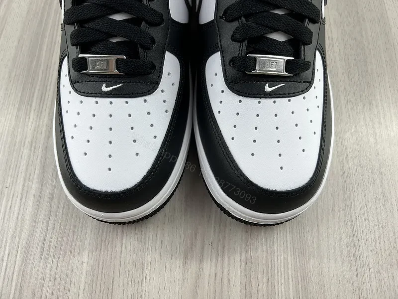 View 9 of Black Leather Low-Top Sneakers with Signature Swoosh