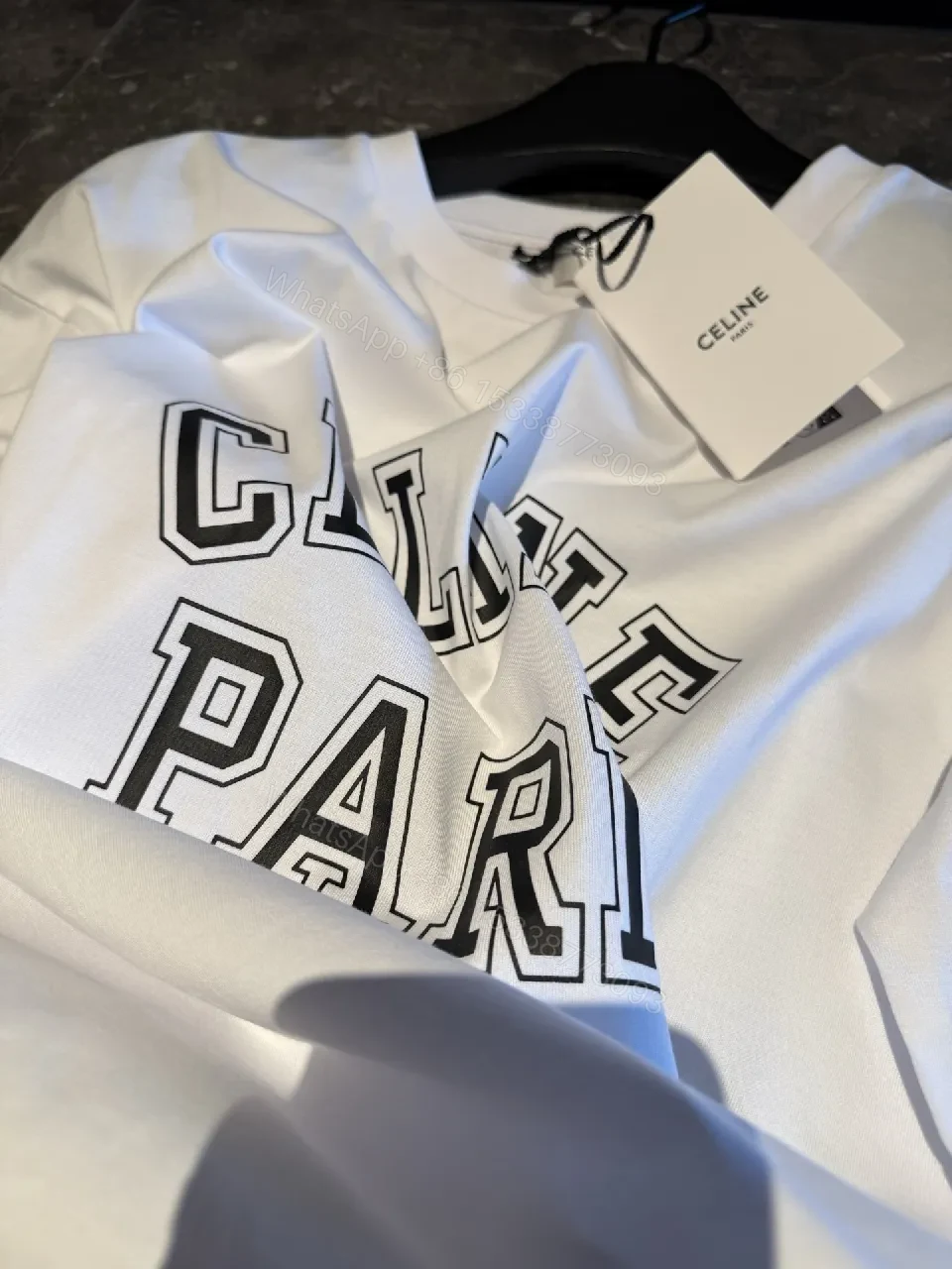 View 6 of White Cotton Modern Tee: Bold Logo, Premium Comfort, Everyday Style