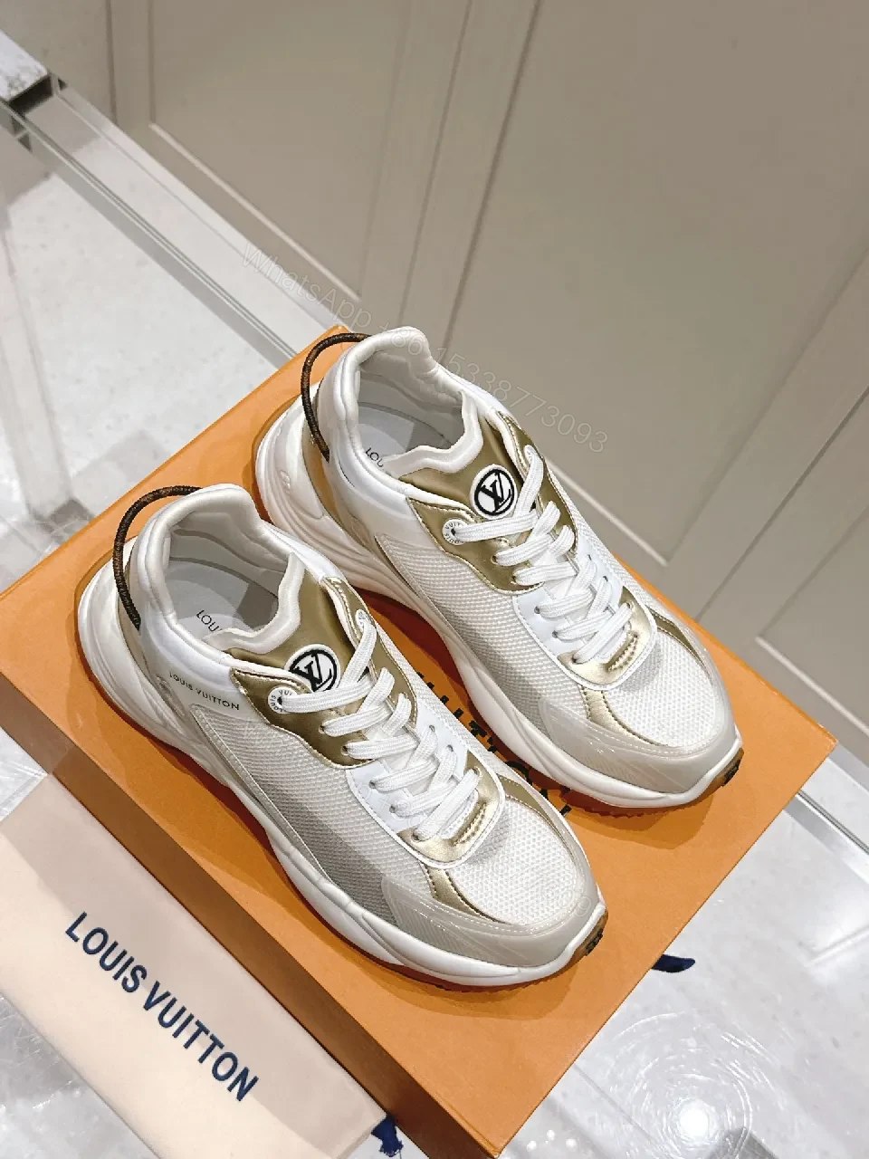 View 3 of Chunky White & Gold Luxe High-Tops: Signature LV Motif Sneakers