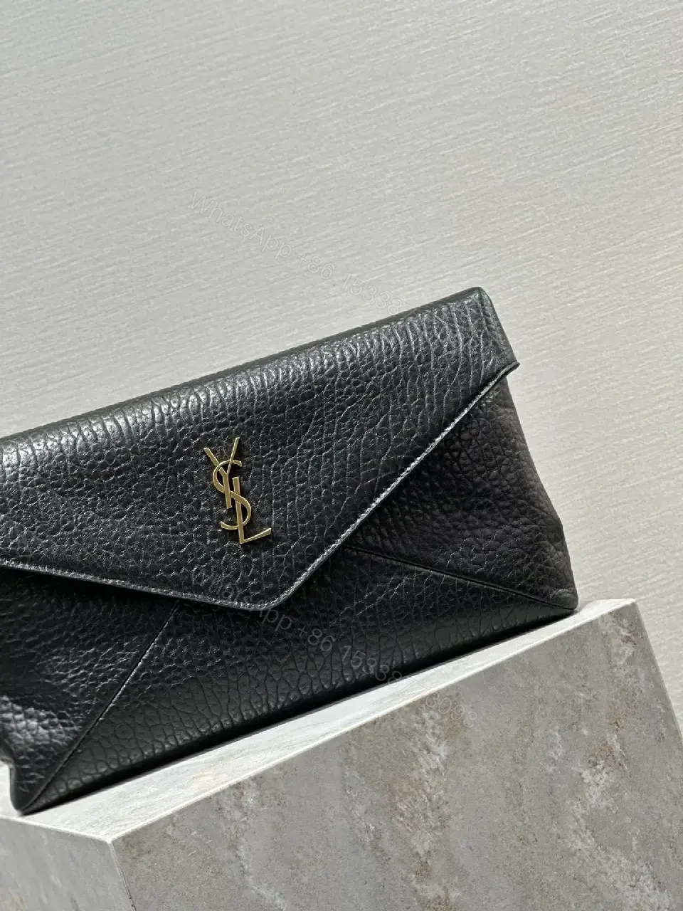 View 6 of Compact Black Leather Envelope Bag with Gold Logo
