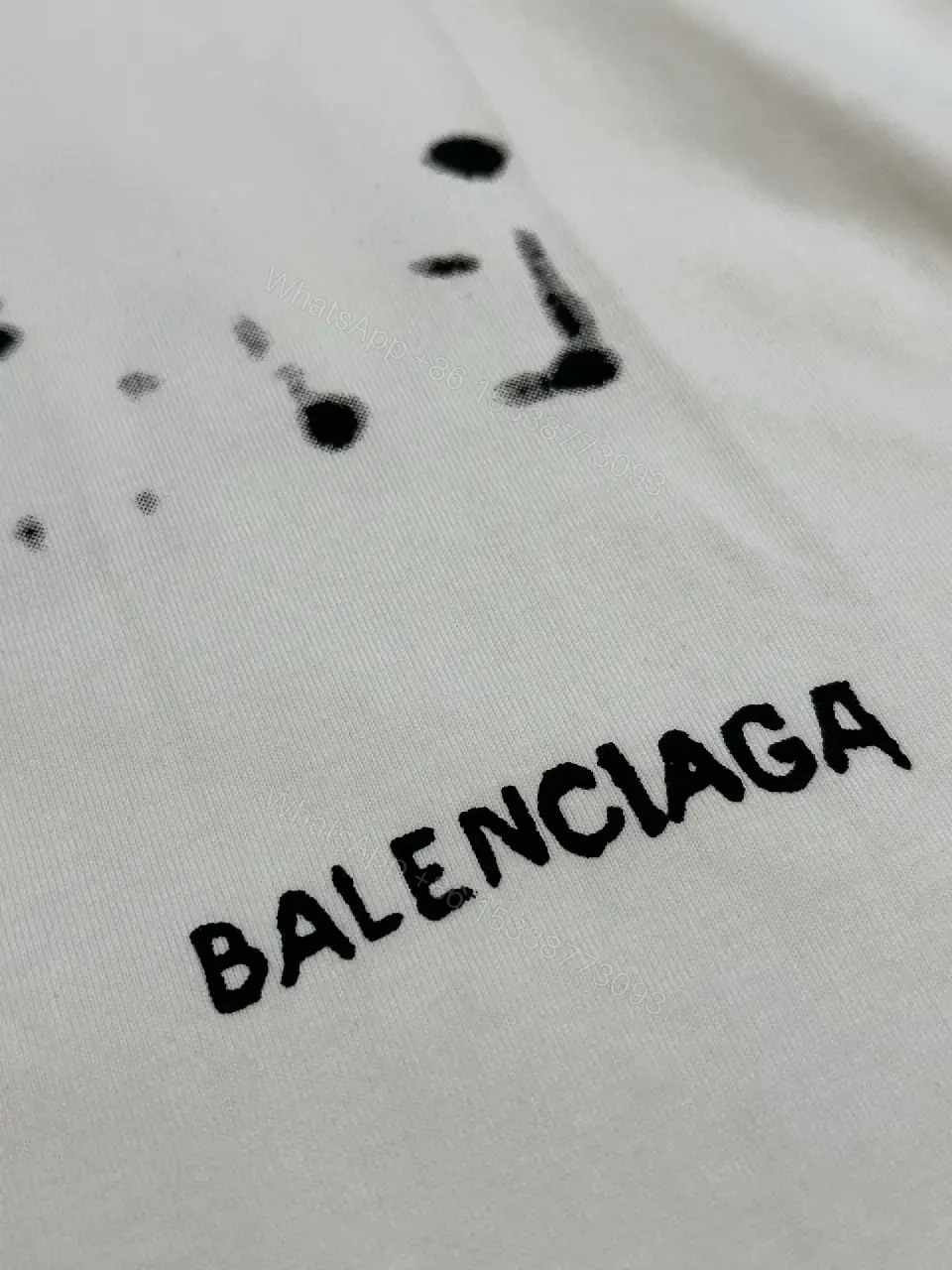 View 4 of Oversized Graphic Tee with Subtle Distress and Logo – Premium Cotton