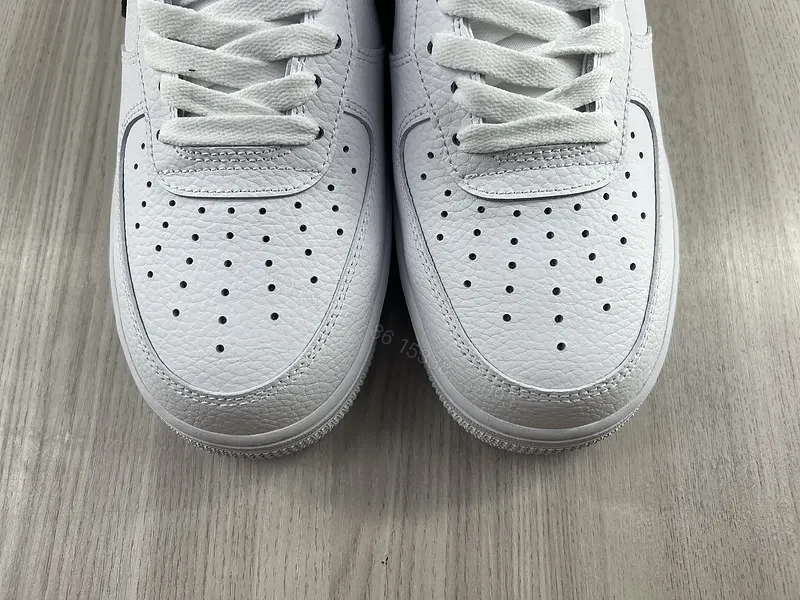 View 5 of White Leather Sneaker + Leather + Minimalist + Bold Swoosh + Classic Air Force Style
