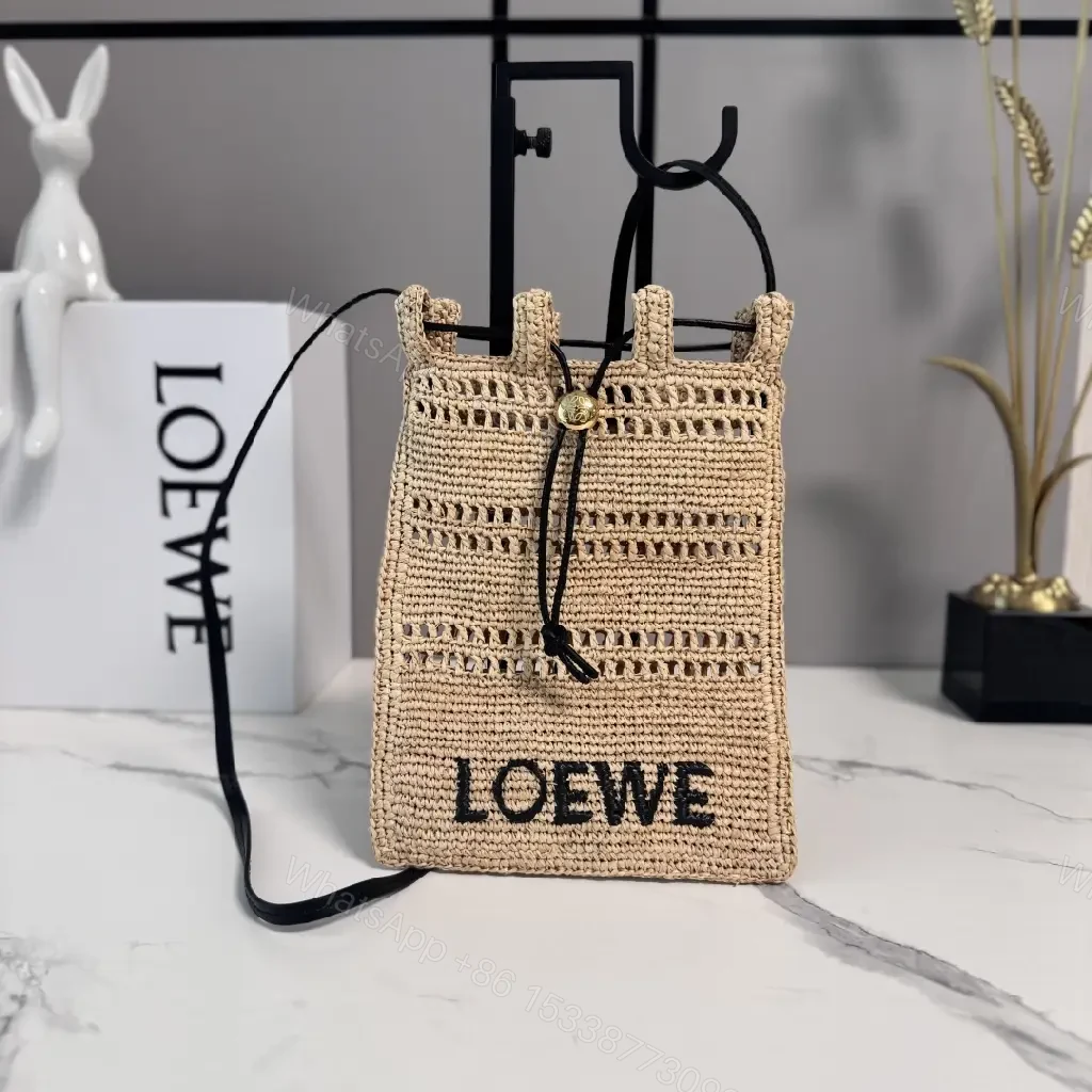 View 2 of Beige Straw Crochet Bag with LOEWE Logo Drawstring Tote