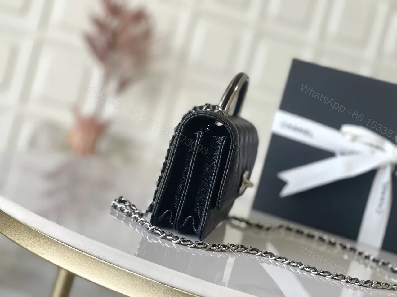 View 5 of Black Quilted Leather Mini Bag - Chain Handle, Compact Luxury