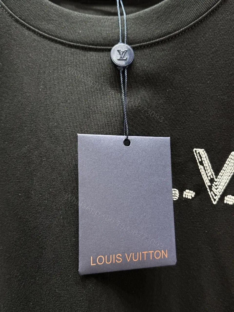 View 8 of Minimalist Black Cotton Tee with Subtle LV.M Logo
