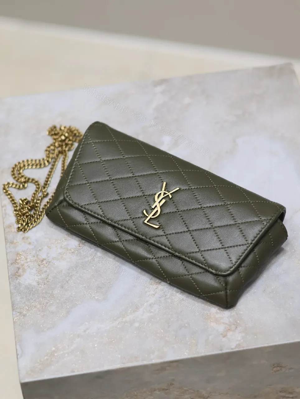 View 8 of Soft-Quilted Leather Clutch with Gold Emblem, Evening Style, Compact Luxury