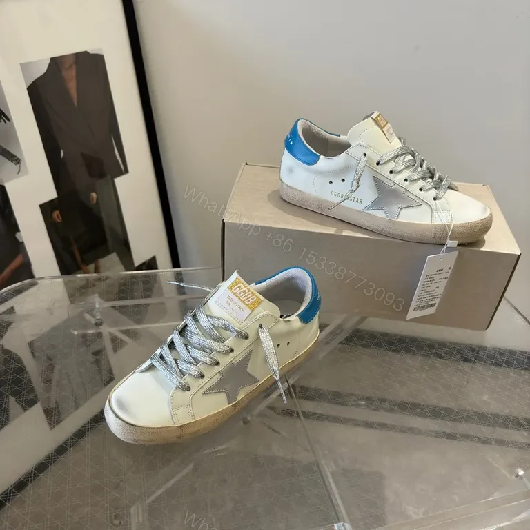 View 2 of Premium Off-White + Leather Sneaker with Blue Heel & Star Details