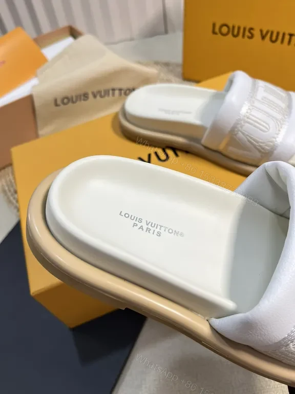 View 4 of Louis Vuitton Luxe Textured Slides with Logo Embellishment