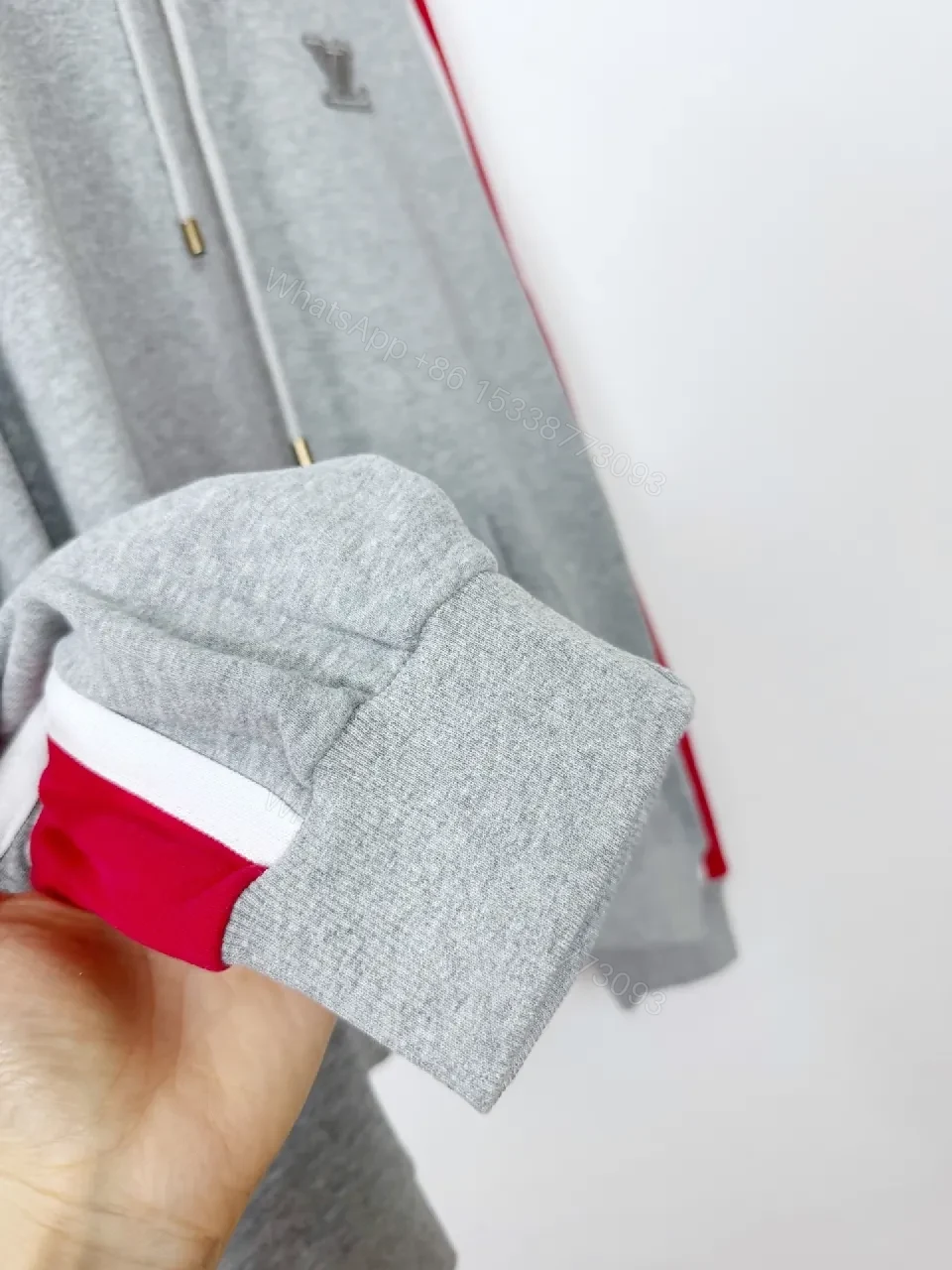 View 5 of Grey Mélange Hoodie with Red Tape – Premium Comfort & Embroidery