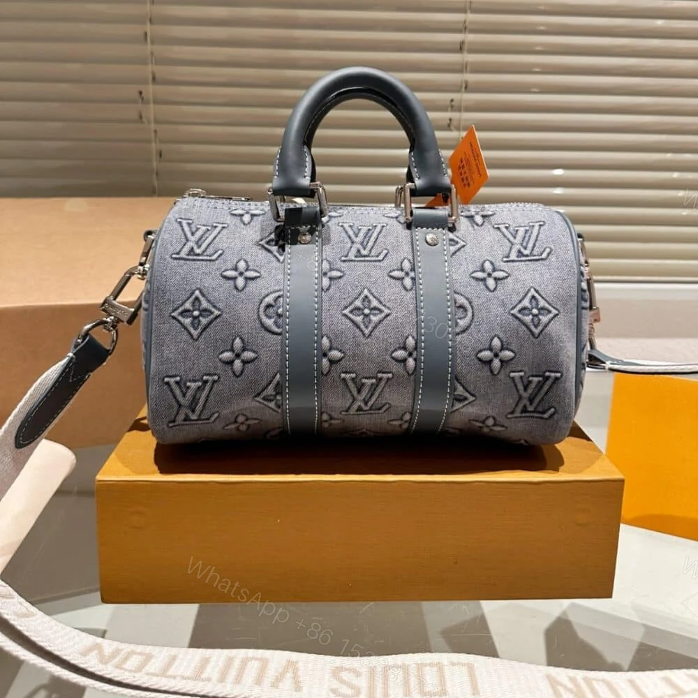 View 2 of Louis Vuitton Keepall Bandoulière 25 Monogram Washed Denim Canvas 24Cm M22762