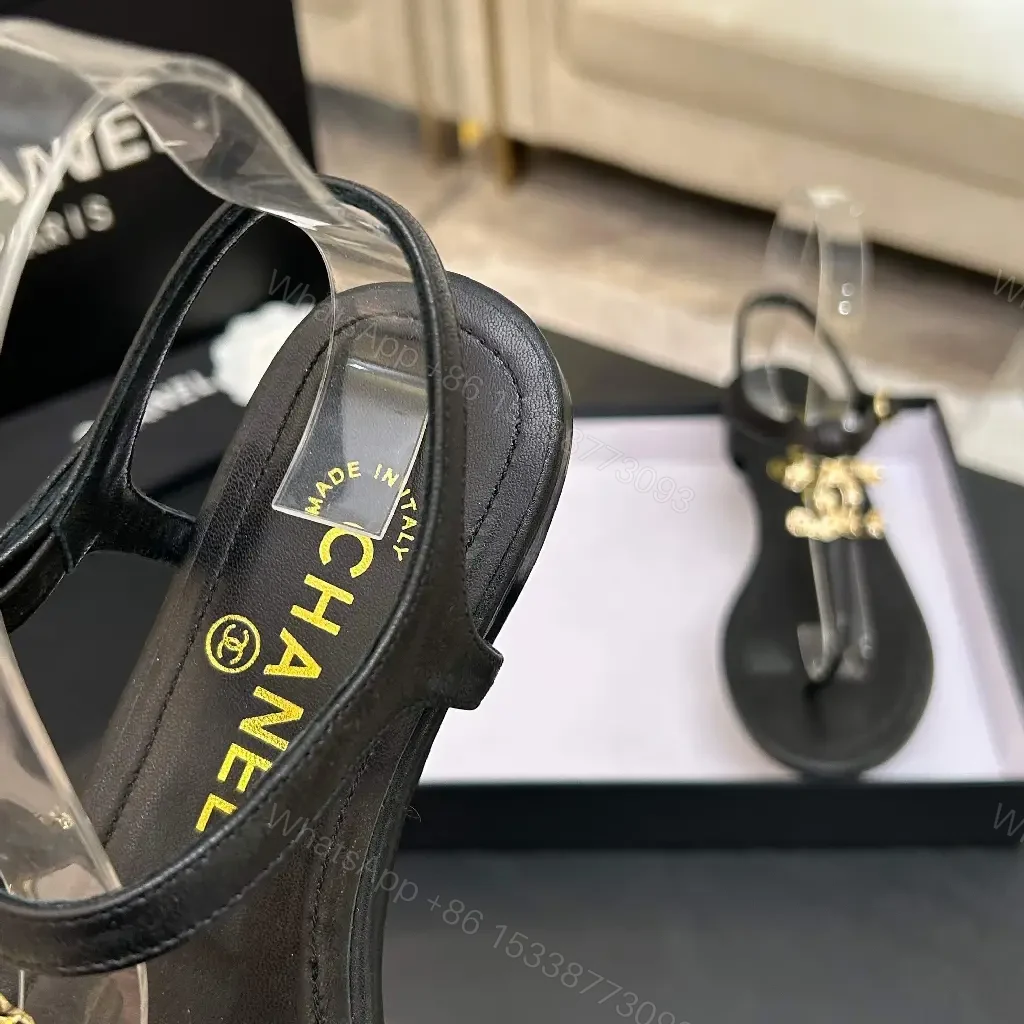 View 6 of Minimalist Black Leather Sandals with Gold Charms - Elegant Comfort