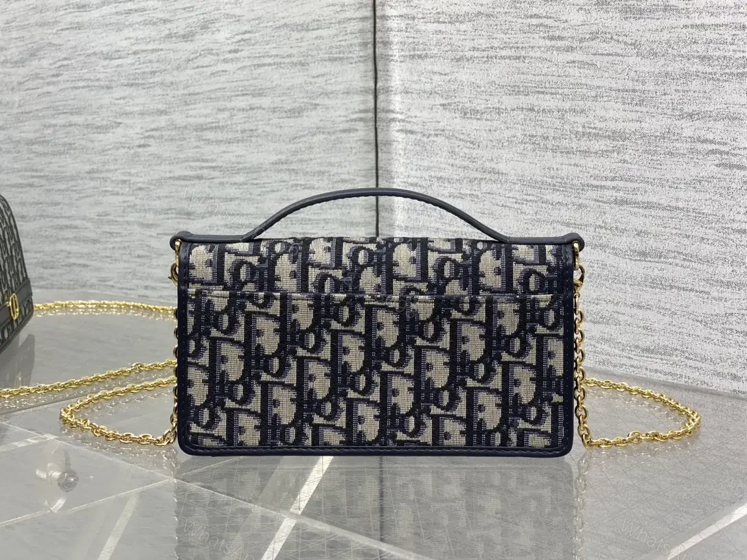 View 3 of Navy monogram canvas leather-trim shoulder bag for everyday luxury