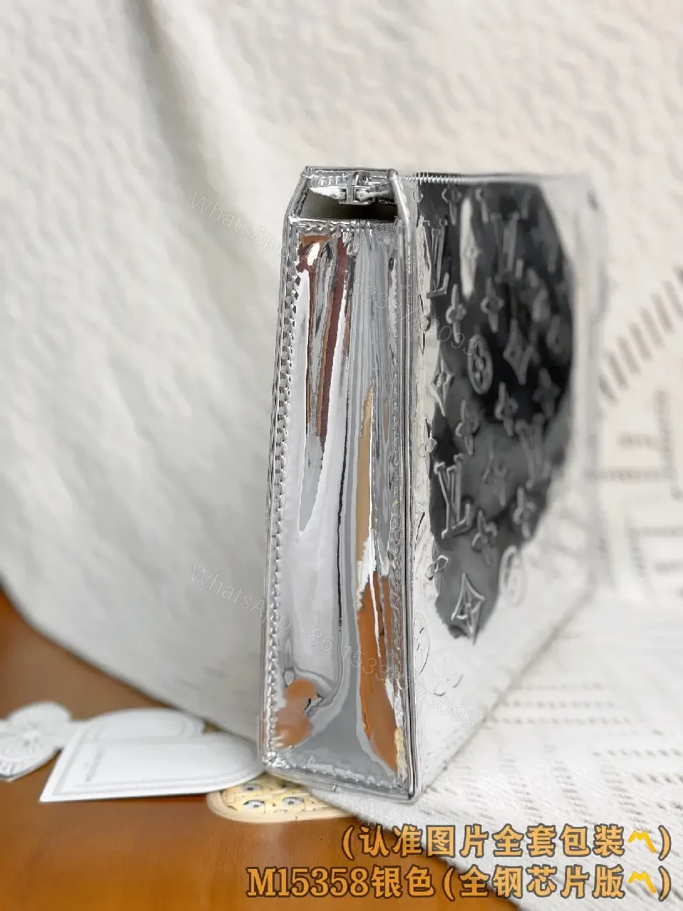 View 3 of Metallic Silver Pouch with Signature Motifs—Chic All-Day Gleam