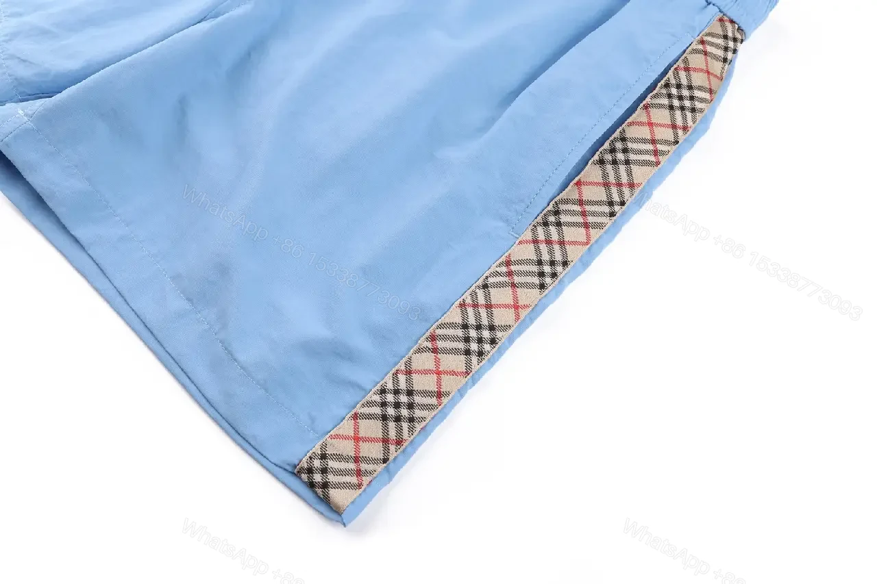 View 8 of Light Blue Cotton-Blend Swim Shorts with Burberry-Check Side Strips