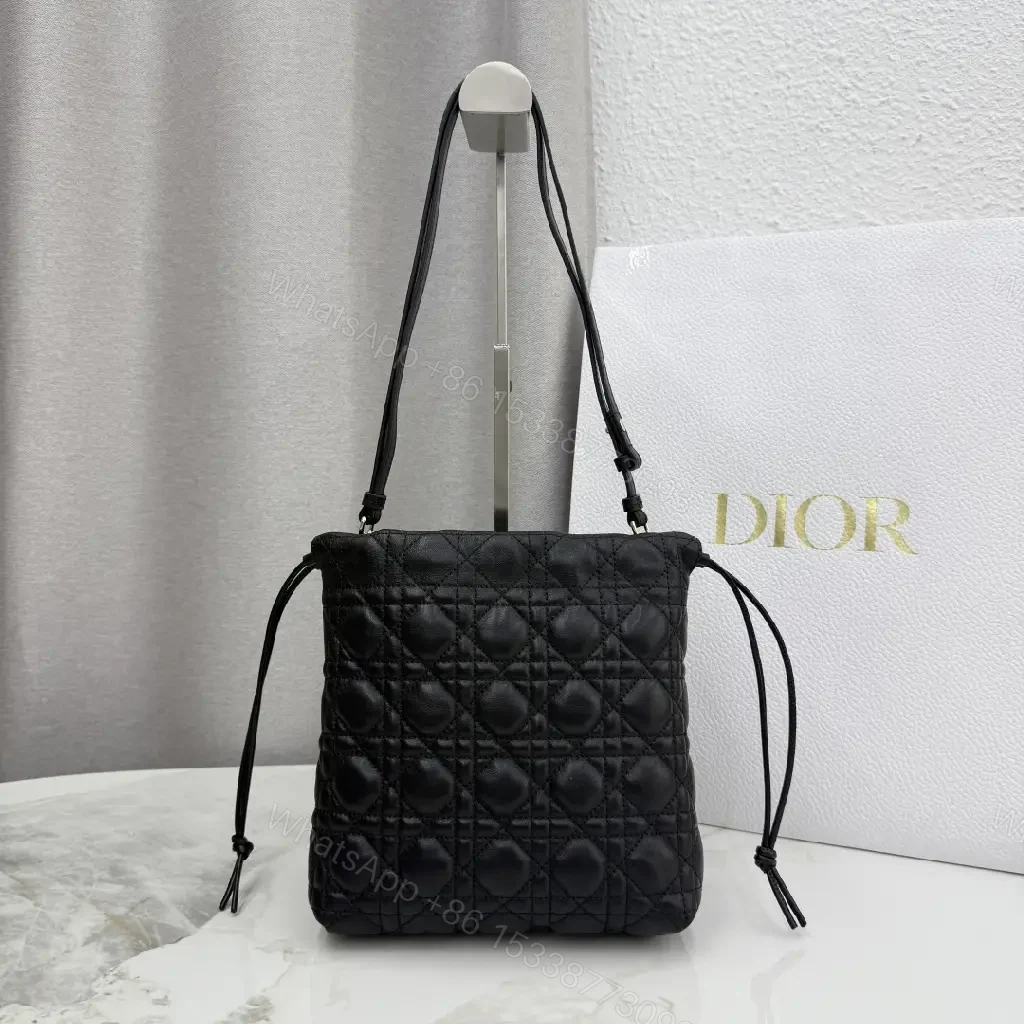 View 5 of Quilted Black Drawstring Bucket Bag with Gold Hardware