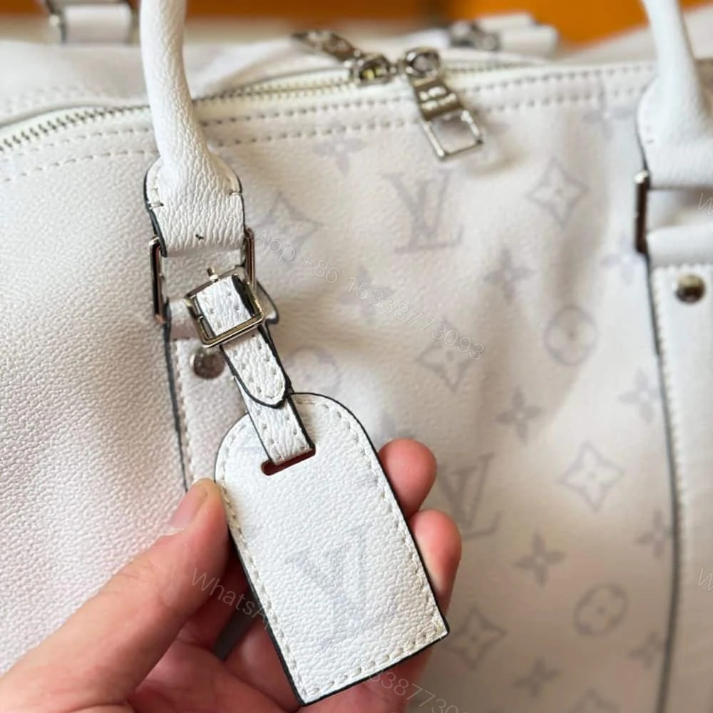 View 5 of Louis Vuitton Keepall 5 Bandouliere Optical White 40Cm M30885