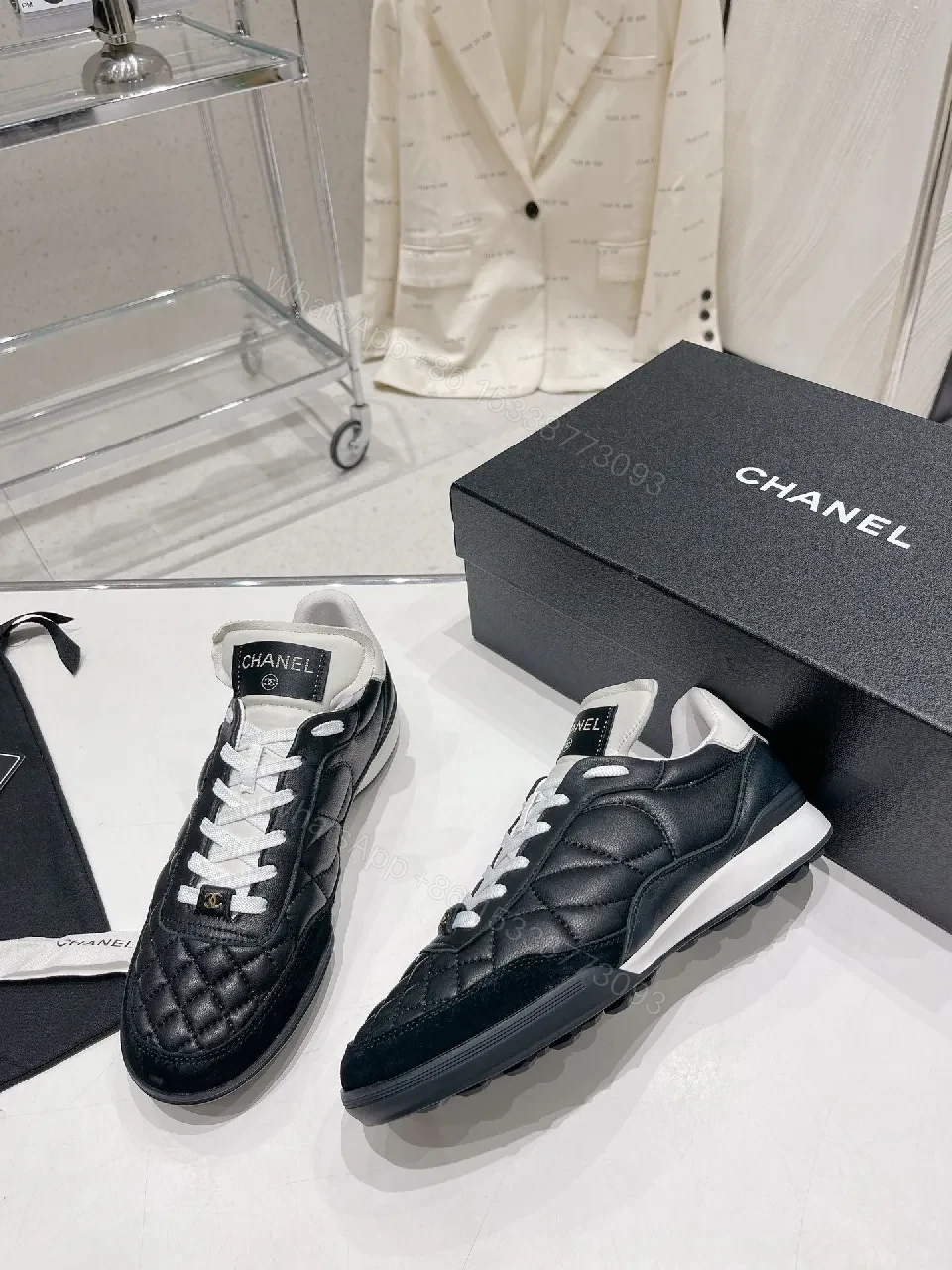 View 8 of Quilted Black Leather Sneakers with Luxe Branding Detail