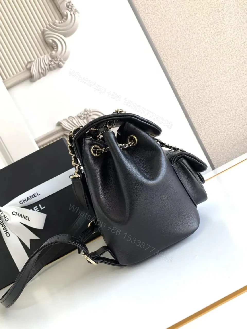 View 3 of Quilted Black Backpack with Gold Hardware Luxury Mini Bag