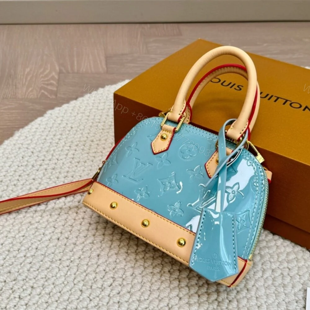 View 2 of Louis Vuitton Alma Nano Monogram Vernis Embossed Sky Blue 18Cm M24062