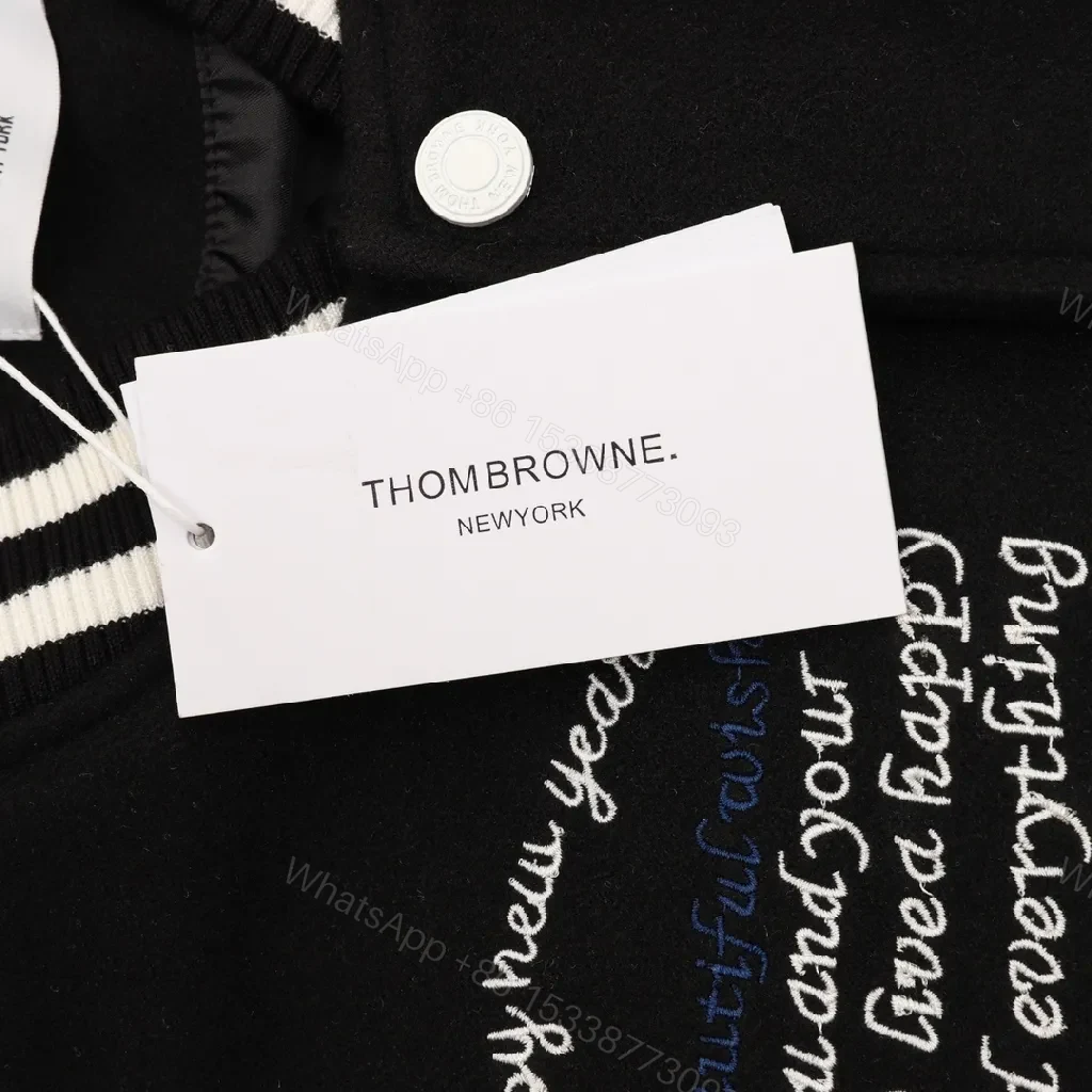 View 6 of Bold Black & Off-White Varsity Jacket with Embroidered Graffiti Details