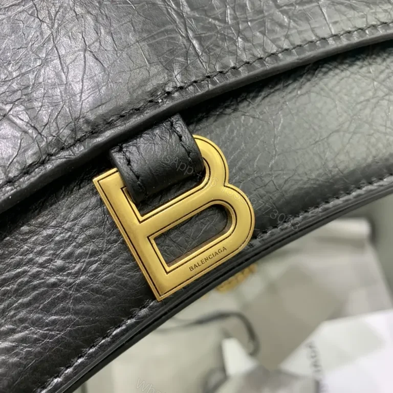 View 5 of Chic Black Leather Mini Bag with Gold B Clasp â€“ Compact Luxury