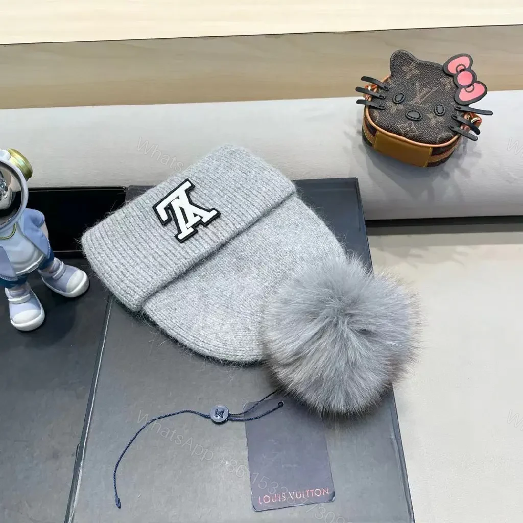 View 4 of Cozy Gray Knit Beanie with LV Emblem Accent