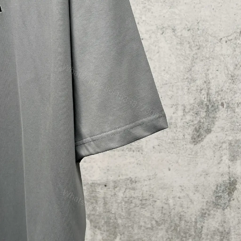 View 7 of Neutral Cotton Oversized Tee: Minimal Logo, Elevated Comfort