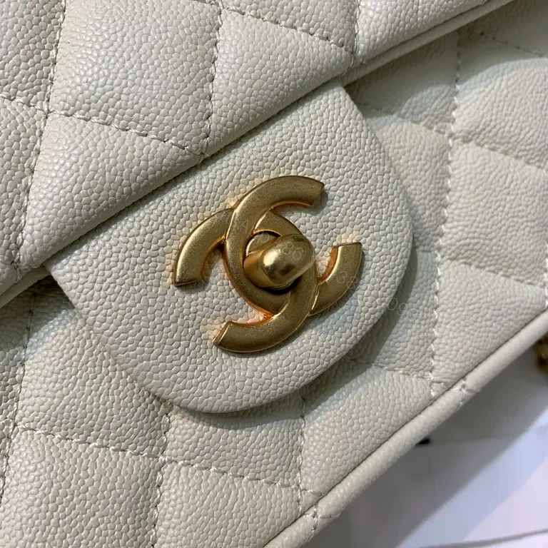 View 2 of Compact Quilted Handbag with Gold Chain Strap - Timeless Luxury
