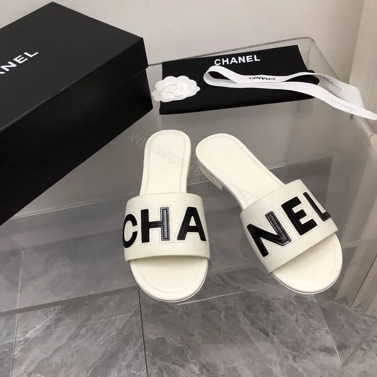Chanel-Inspired White Leather Slides with Bold Logo Strap — view 1