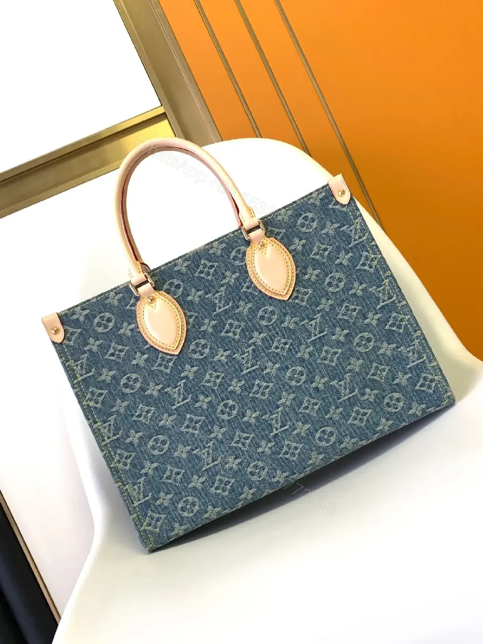 View 5 of Denim Monogram Tote: Premium Denim Leather-Trim Tote with Signature Details