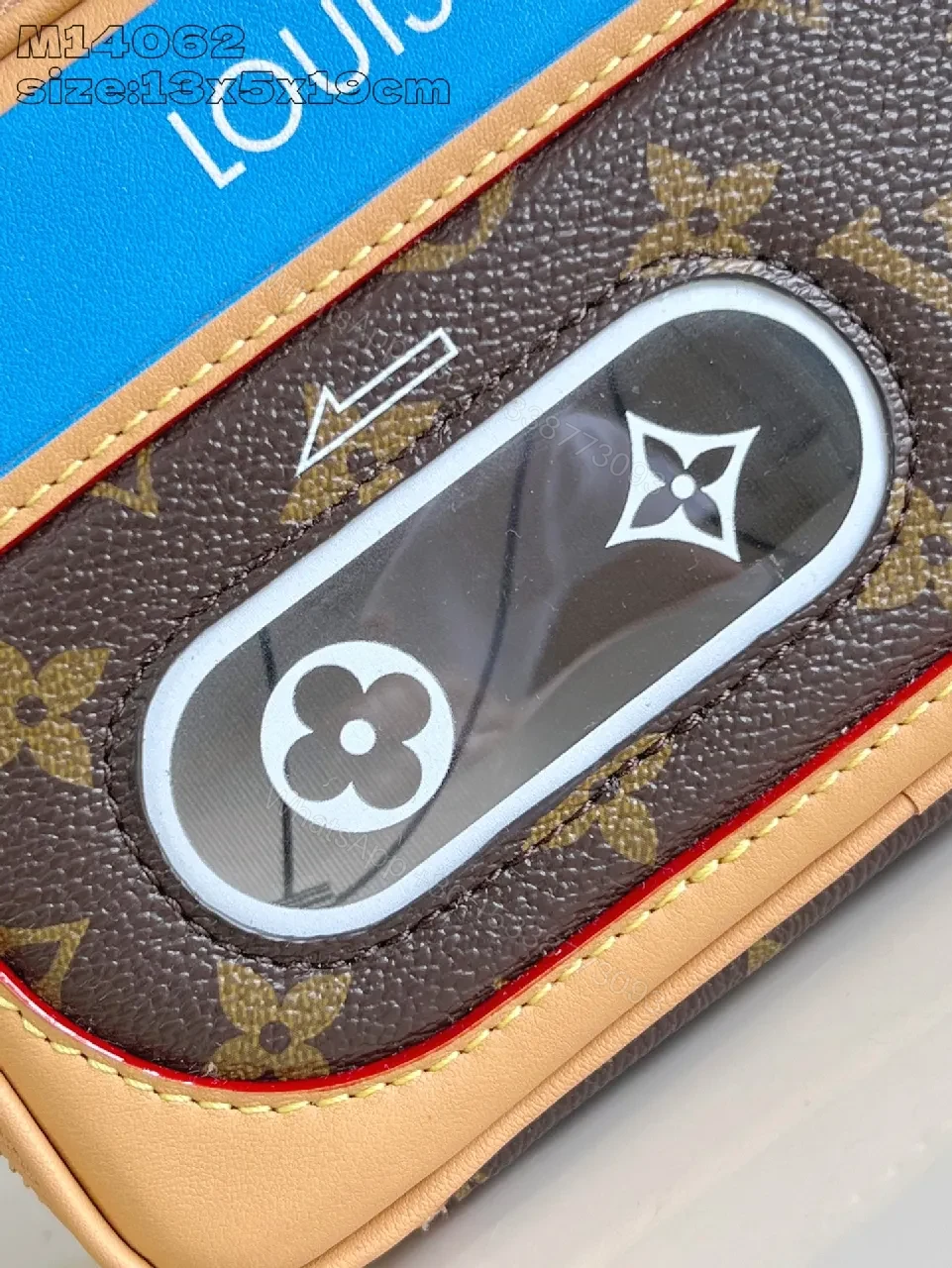 View 3 of Compact Luxury Crossbody: Monogram Canvas with Blue Accent and Gold Hardware