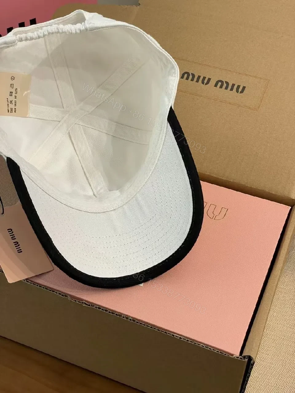 View 3 of White Cotton Cap | Structured Six-Panel, Logo Detail, Adjustable Fit