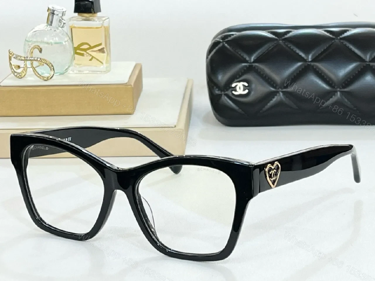 View 9 of Black Cat-Eye Sunglasses with Gold Heart Detail - Premium Acetate