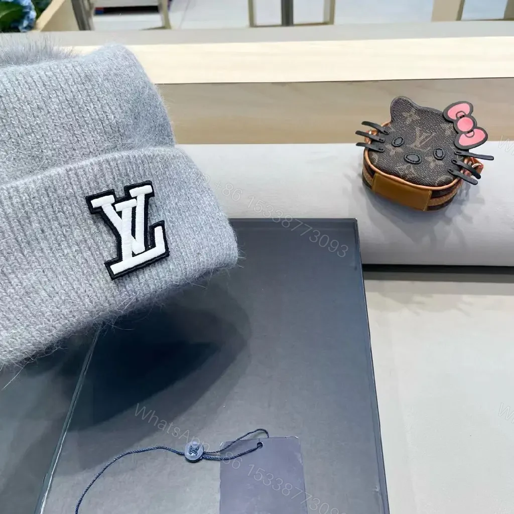 View 6 of Cozy Gray Knit Beanie with LV Emblem Accent