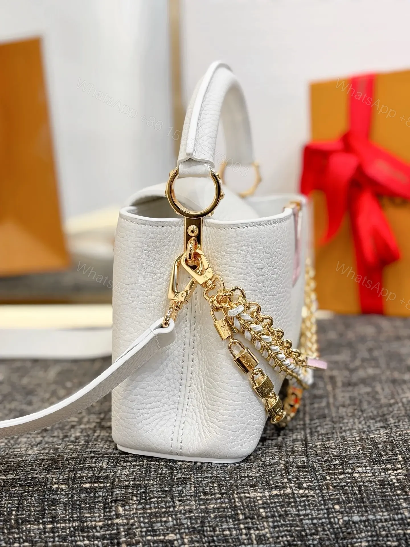 View 5 of Louis Vuitton Capucines bag in white Taurillon leather