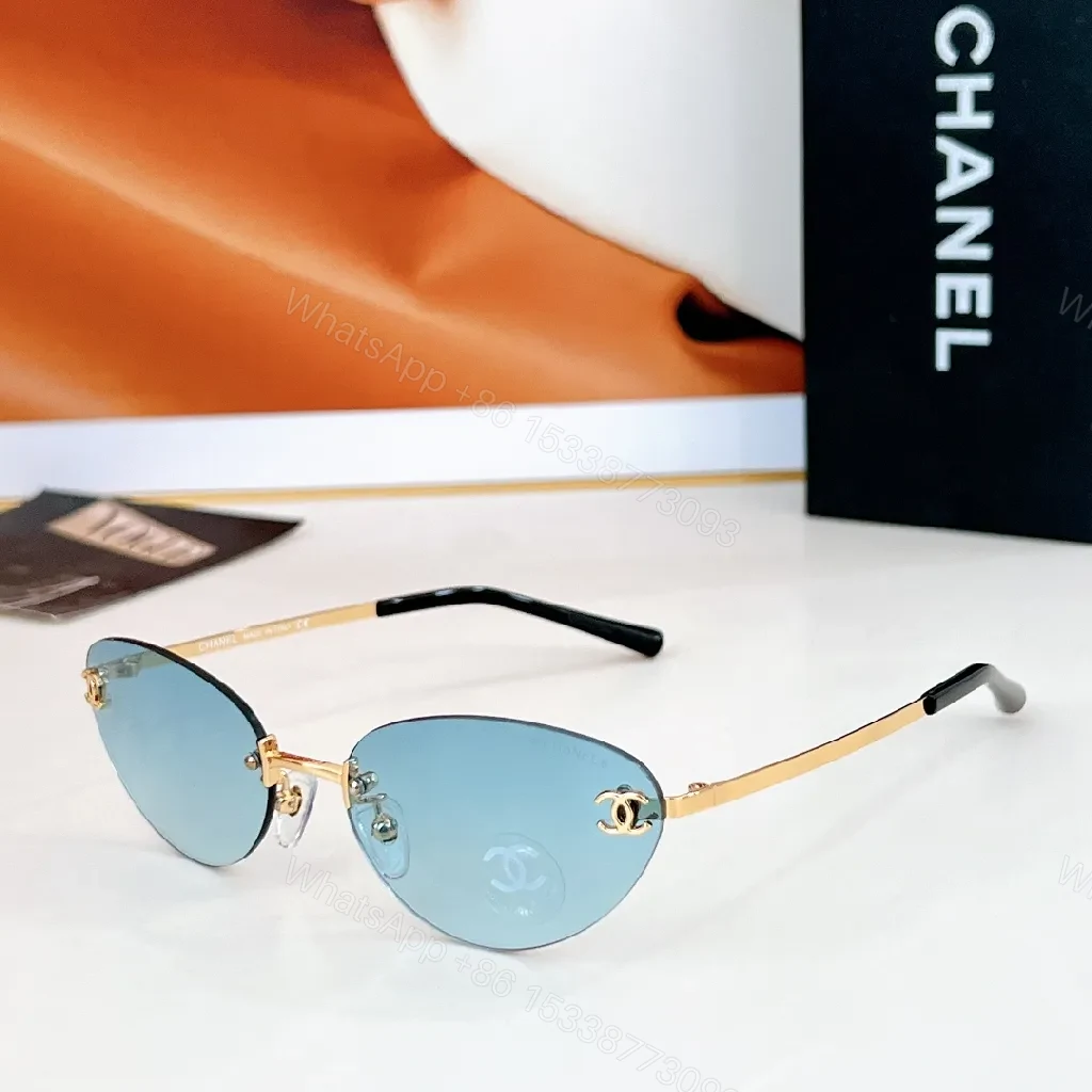 Rimless Blue Lens Sunglasses with Gold-Tone Frames — view 1